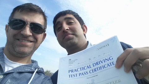 Giuseppe Romeo celebrating with a learner who has just passed his practical driving test Giuseppe Romeo celebrating with a learner who has just passed his practical driving test